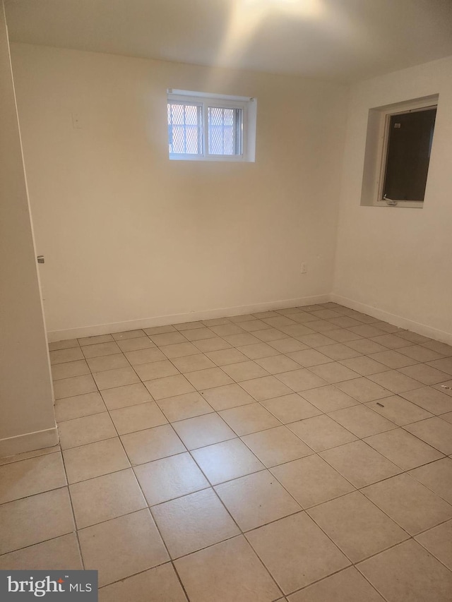 3839 1st St SE, Washington, DC 20032 - spare room featuring light tile patterned flooring and baseboards