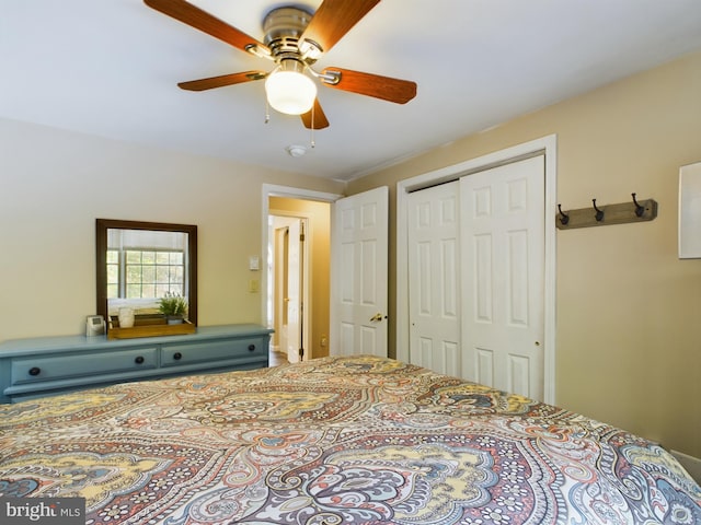 bedroom featuring ceiling fan and a closet