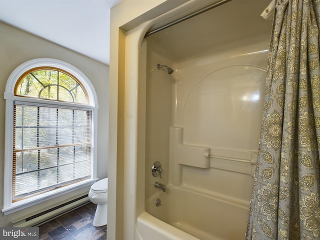 bathroom with shower / bath combo with shower curtain and toilet