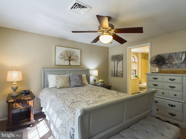 carpeted bedroom featuring connected bathroom and ceiling fan