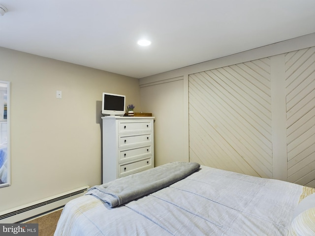 bedroom featuring carpet flooring and baseboard heating