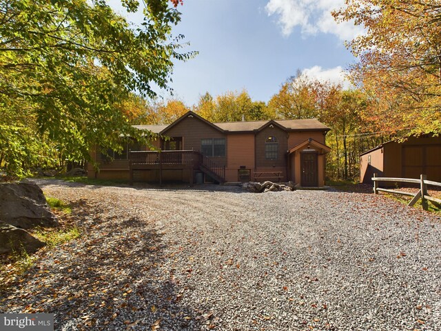 view of front facade featuring a wooden deck