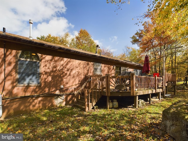 back of property featuring a deck