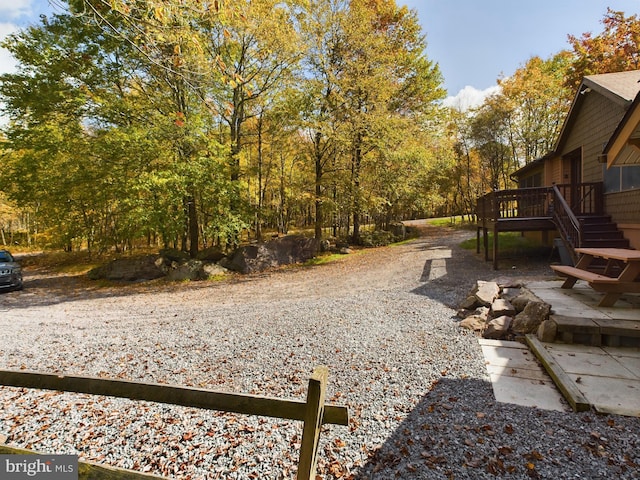 view of yard with a wooden deck