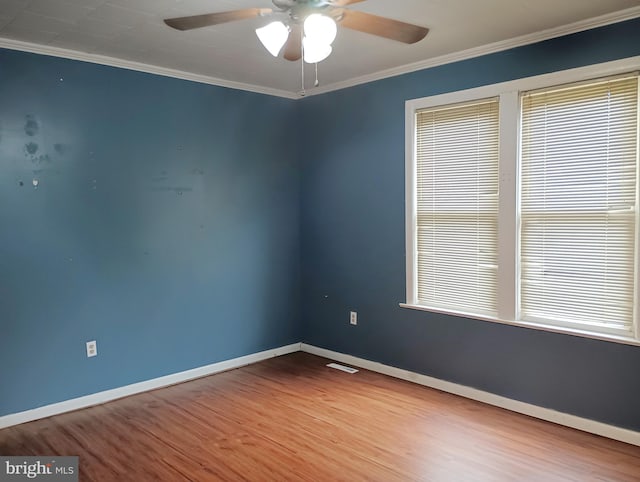 unfurnished room featuring ornamental molding, ceiling fan, and hardwood / wood-style flooring