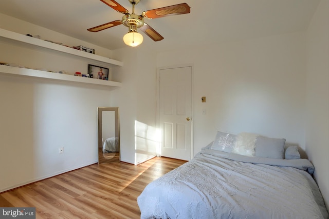 bedroom featuring light hardwood / wood-style floors and ceiling fan