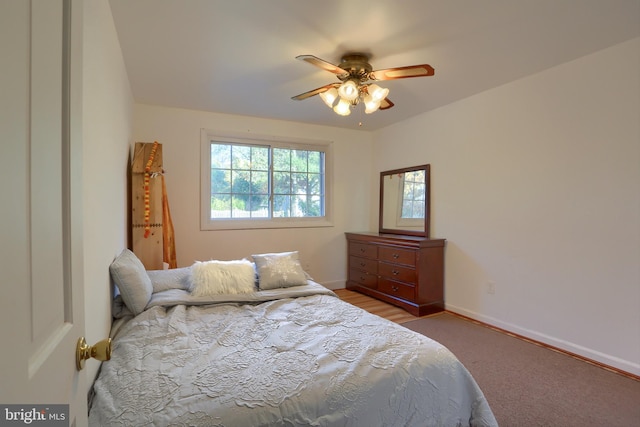 bedroom featuring ceiling fan and carpet floors