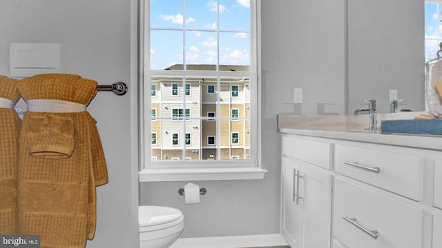 bathroom featuring vanity and toilet