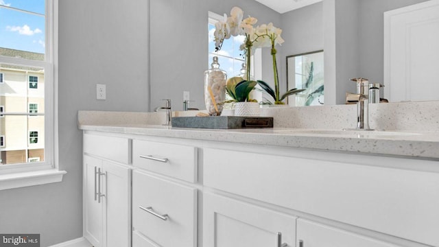 bathroom featuring vanity and plenty of natural light