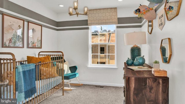 living area with carpet floors and an inviting chandelier