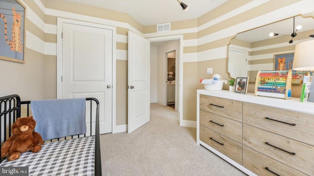 bedroom featuring light colored carpet