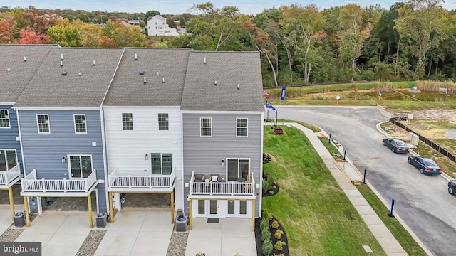 rear view of property with central AC unit