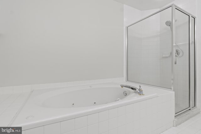 bathroom featuring tile patterned flooring and plus walk in shower