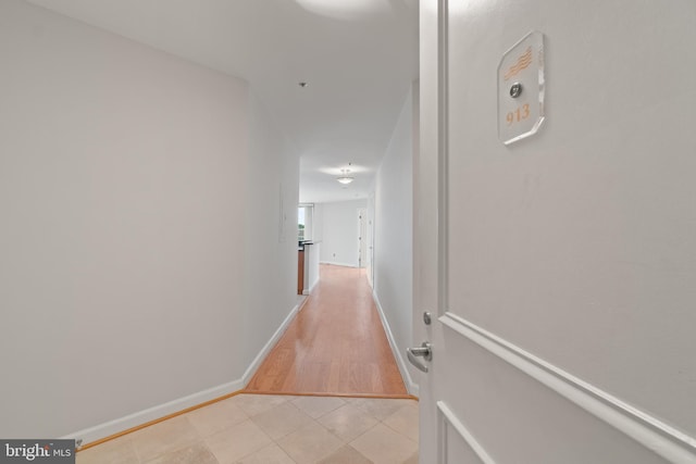 hallway with light wood-type flooring