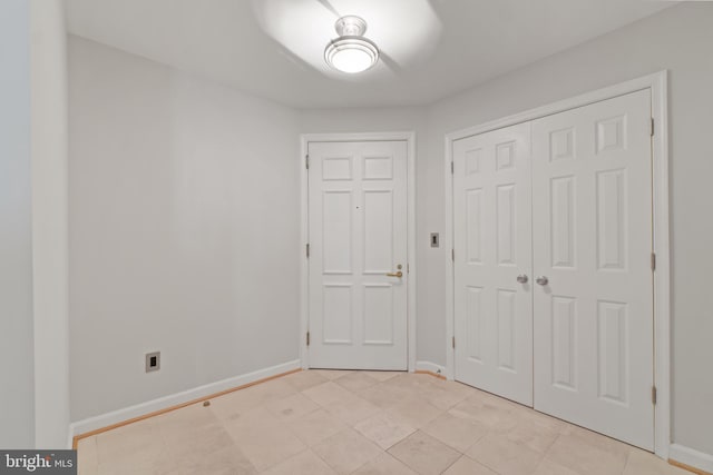 unfurnished bedroom with a closet and ceiling fan