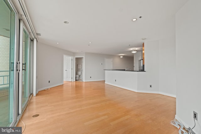 unfurnished living room featuring light hardwood / wood-style flooring