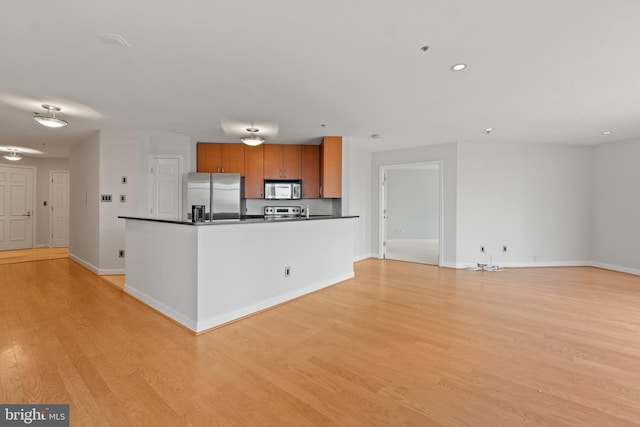 kitchen featuring light hardwood / wood-style flooring and stainless steel appliances