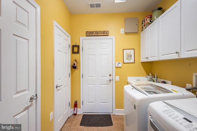 10 Eagle Bluff St, Fredericksburg, VA 22406 - clothes washing area featuring cabinet space, washer and dryer, baseboards, and light tile patterned floors