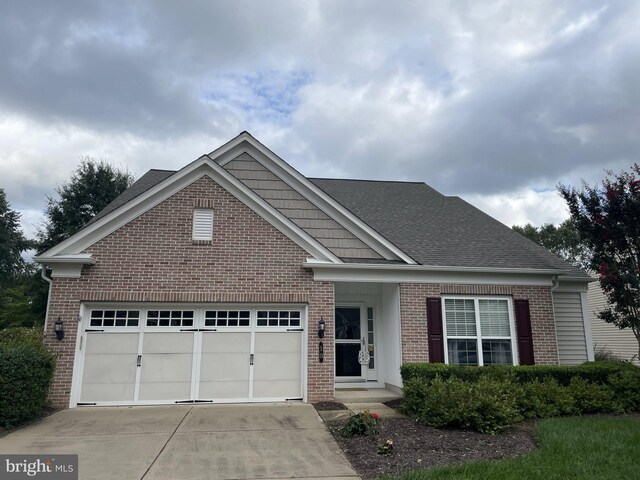 10 Eagle Bluff St, Fredericksburg, VA 22406 - view of front facade with brick siding, an attached garage, concrete driveway, and roof with shingles