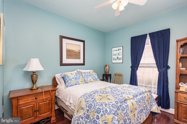 bedroom with ceiling fan and dark hardwood / wood-style floors