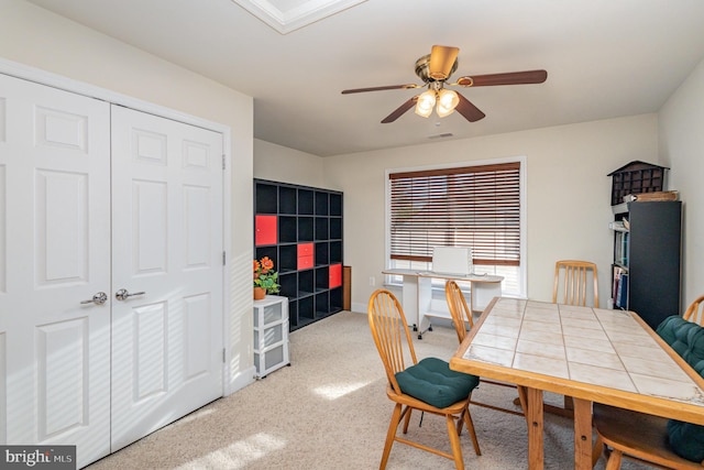 dining space featuring ceiling fan