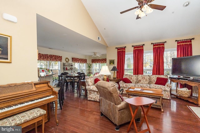 living room with dark hardwood / wood-style flooring, high vaulted ceiling, and ceiling fan