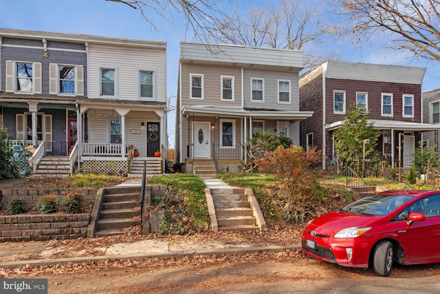 townhome / multi-family property with covered porch