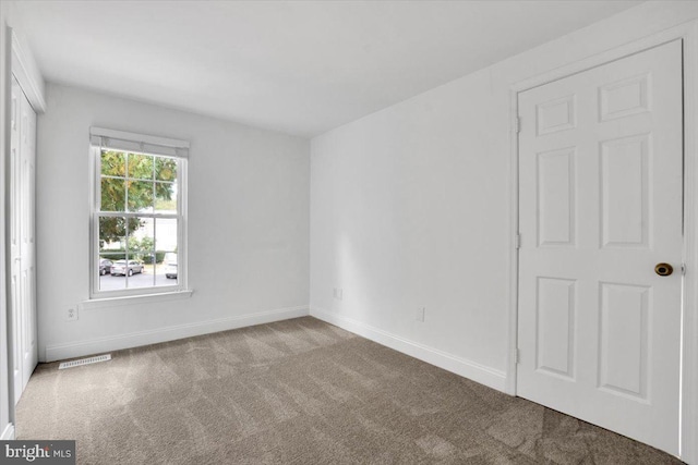 view of carpeted spare room