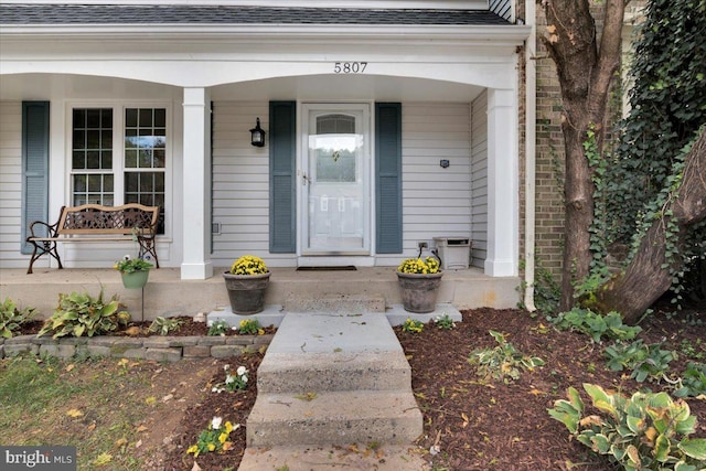 doorway to property featuring covered porch