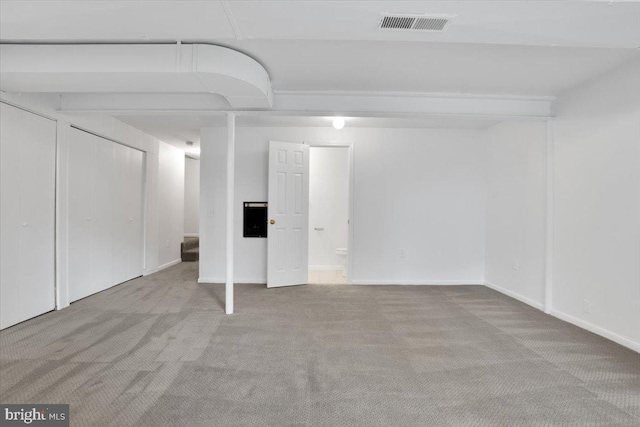 basement with light carpet