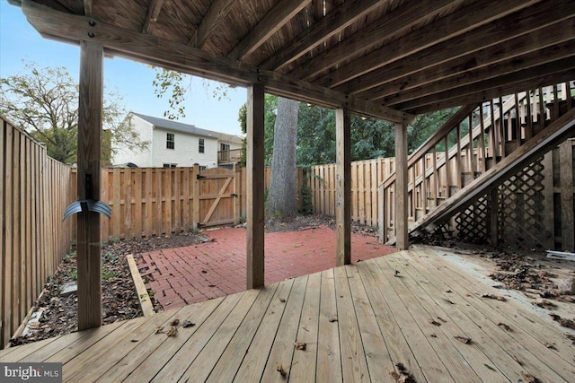 wooden terrace featuring a patio area