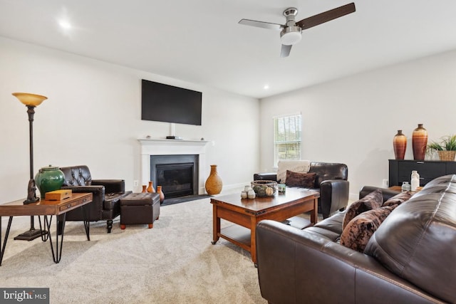 carpeted living room featuring ceiling fan