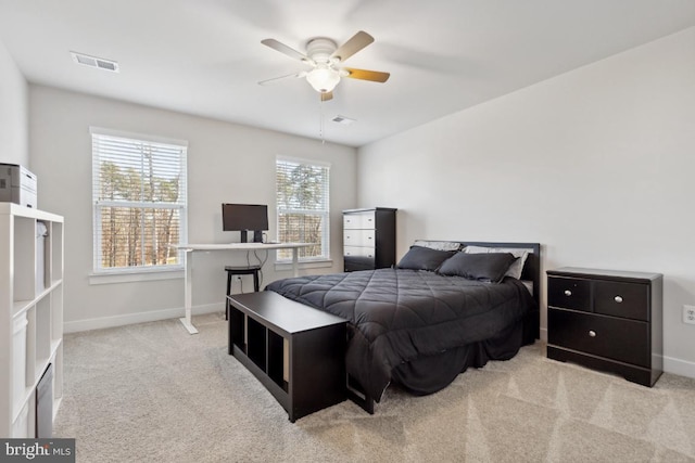 bedroom featuring light carpet and ceiling fan