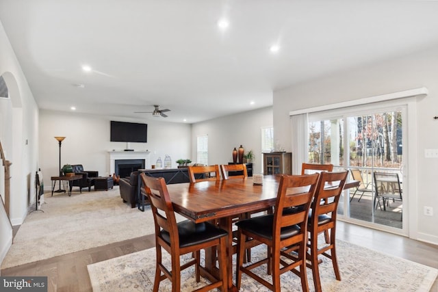 dining room with light wood-type flooring and ceiling fan