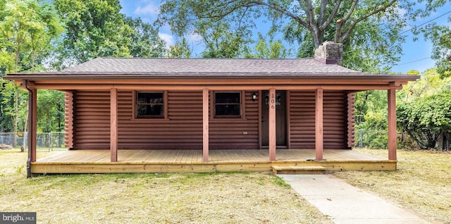 view of front of home with a wooden deck