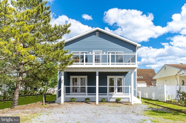 rear view of property featuring french doors