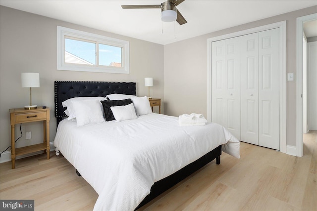 bedroom with a closet, light wood-type flooring, and ceiling fan