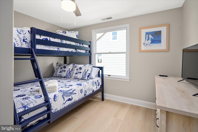 bedroom with hardwood / wood-style flooring and ceiling fan