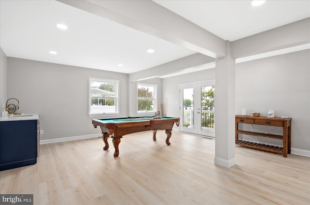 game room featuring pool table, french doors, and light hardwood / wood-style flooring