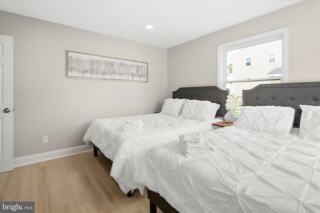 bedroom with light hardwood / wood-style floors