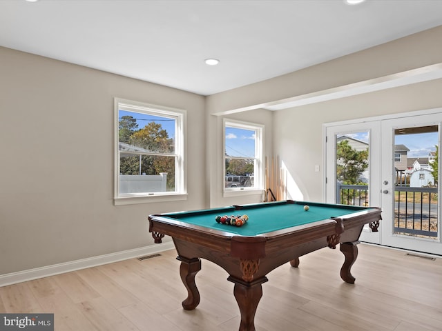 playroom with pool table, light hardwood / wood-style floors, and a healthy amount of sunlight