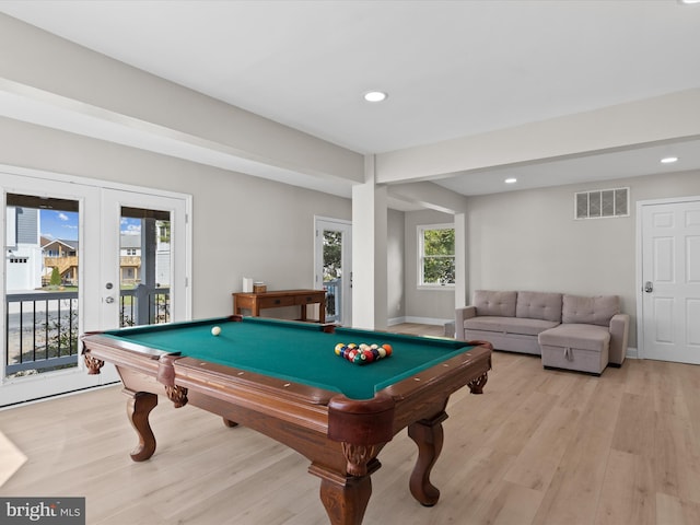 recreation room featuring light wood-type flooring, pool table, and a healthy amount of sunlight