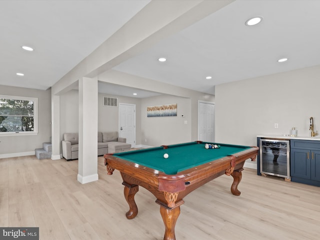 game room with wine cooler, light hardwood / wood-style flooring, wet bar, and billiards