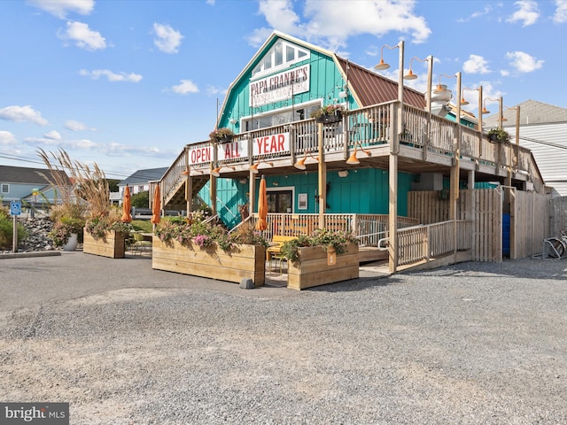 view of front of house featuring a wooden deck