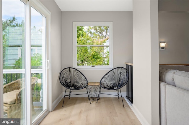 sitting room featuring light hardwood / wood-style flooring