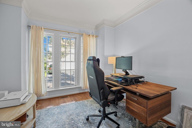 office space with ornamental molding and hardwood / wood-style floors