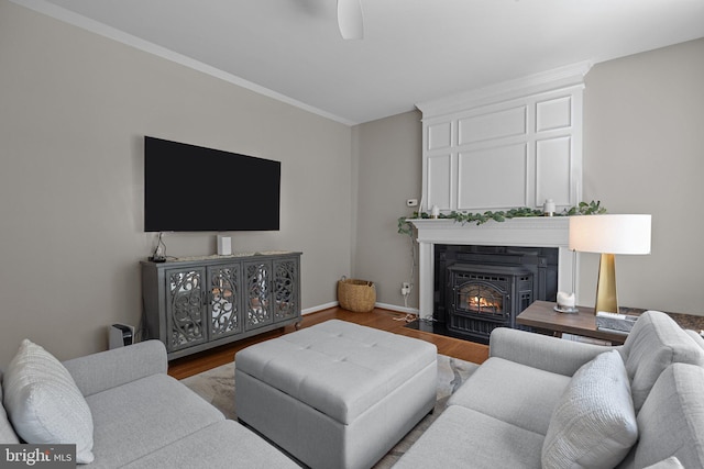 living room with ornamental molding and hardwood / wood-style floors