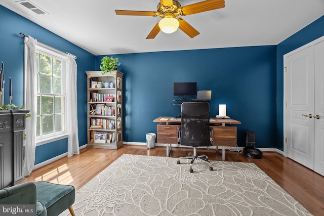 office area with ceiling fan and wood-type flooring