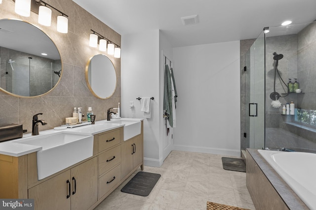 bathroom featuring vanity, plus walk in shower, and tile patterned flooring