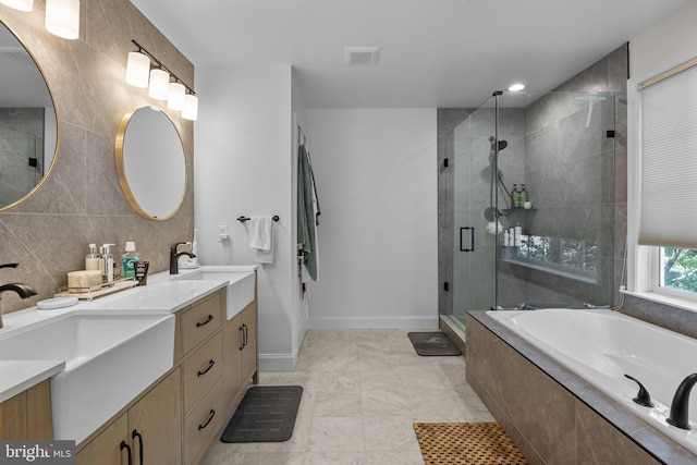 bathroom with vanity and plus walk in shower